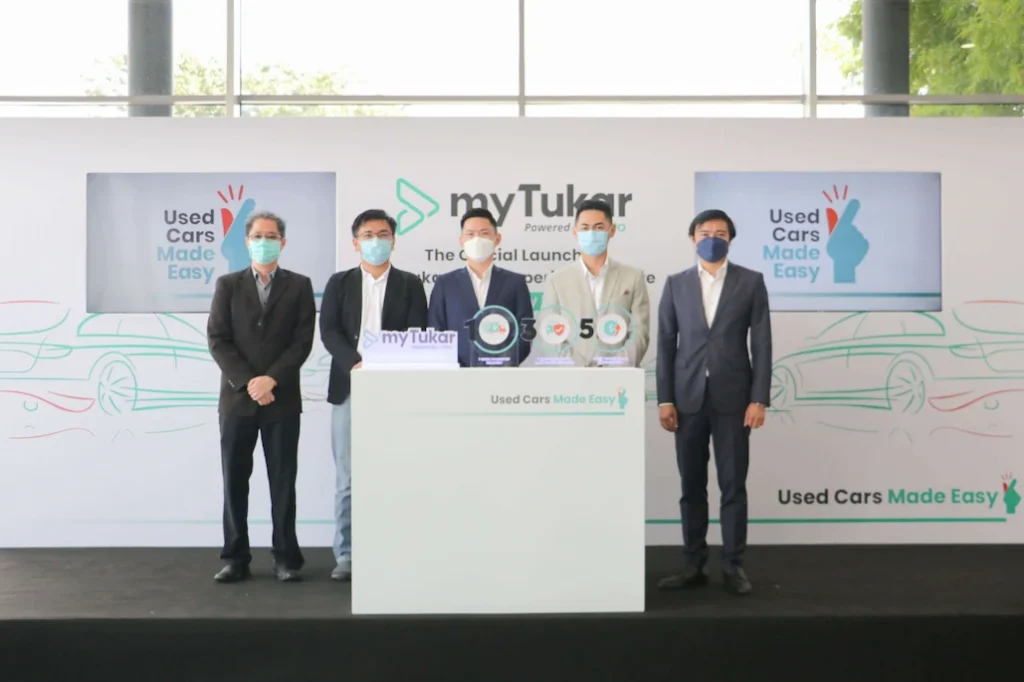 myTukar executives on stage at the Used Cars Made Easy launch event in Malaysia