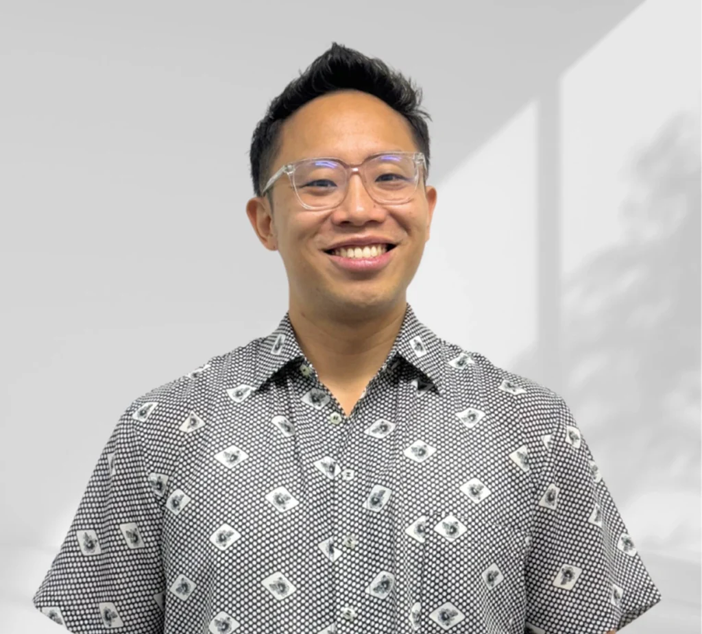 Jeremy Foo, founder of Elliot & Co., smiling in a patterned shirt